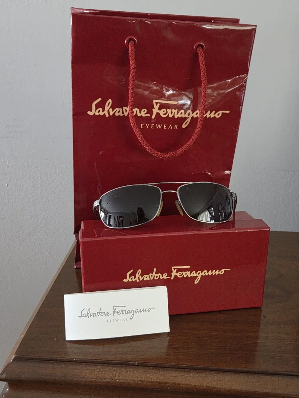Salvatore Ferragamo Silver Frame Sunglasses with Black Lenses